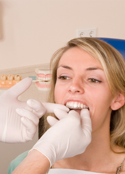 Dentist placing ClearCorrect page