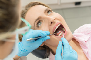 Dentist in Enterprise checks your teeth and gums