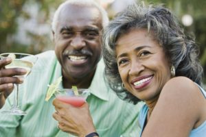 A man and woman enjoying a drink.