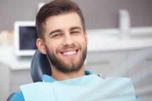 man smiling in dentist chair