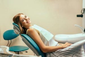 person sitting in dentist's chair