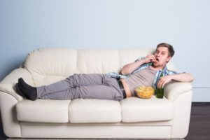 person snacking in potato chips