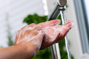 Wallowa County dentist washes their hands in COVID-19