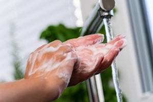 Wallowa County dentist washes their hands in COVID-19 