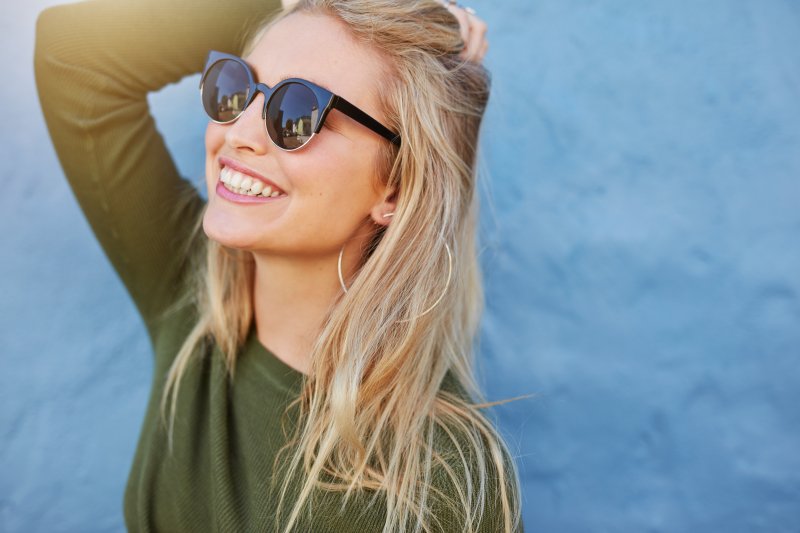 girl smiling looking towards the sun