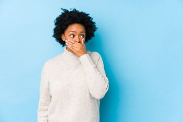 person with stained teeth covering their mouth