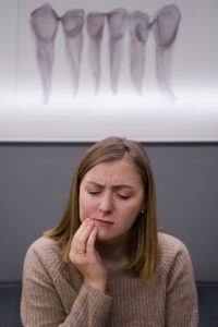 Woman with a toothache at dentist