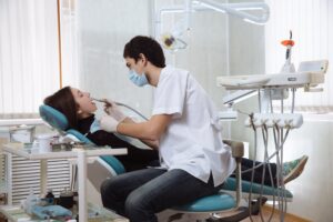 Woman in dentist’s chair for teeth cleaning